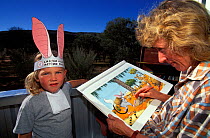 Kaye Kessing, Illustrator of the Easter Bilby book, and Ariane with Bilby ears and collar, Greater bilby (Macrotis lagotis) vulnerable species, Alice Springs, Northern Territory, Australia, May 1995