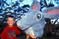 Children with Bilby (Macrotis lagotis) head mask, part of the education programme at Earth Sanctuary, Yookamurra, South Australia, April 1997, vulnerable species