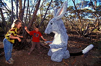 Children with Bilby (Macrotis lagotis) actor, part of the education programme at Earth Sanctuary, Yookamurra, South Australia, April 1997, vulnerable species