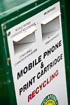 Mobile phone and ink cartridge recycling point at a recycling centre, Stroud, Gloucestershire, UK, February 2008.