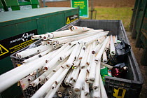 Fluorescent light tube recycling at a recycling centre, Stroud, Gloucestershire, UK, February 2008.