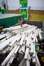 Fluorescent light tube recycling at a recycling centre, Gloucestershire, UK.