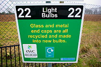 Light bulb recycling information sign at a recycling centre, Stroud, Gloucestershire, UK.