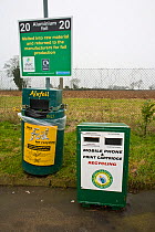 Recycling bins for aluminium foil and mobile phones and print cartridges at a recycling centre, Stroud, Gloucestershire, UK, February 2008.