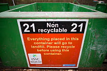 Non-recyclable bins with information sign, for landfill waste at a recycling centre, Gloucestershire, UK, February 2008.