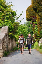Walkers on the Cotswold Way National Trail at Painswick, Gloucestershire, UK, May 2008.