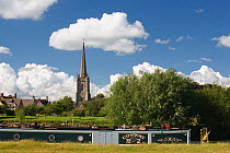 Barge on the River Thames at Lechlade with Lechlade Church in the background, Gloucestershire, UK, July 2008.