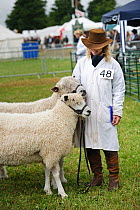 Cotswold Lion rare breed sheep with breeder at the Cotswold Farm Show, Cirencester, UK, July 2008.