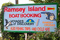 Information sign for Ramsey Island boat trips, Pembrokeshire Coast Path, Wales, June 2009.