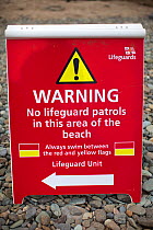 Lifeguard warning information sign on the Pembrokeshire Coast Path, Wales, UK, June 2009.