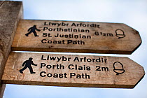 Coast Path information sign for Port Clais and St Justinian, Pembrokeshire, Wales, UK, June 2009.