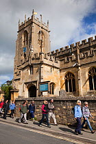 Walkers going past a church on Winchcombe Way during the Walking Festival 2011, Tewkesbury, Gloucestershire, UK, May 2011.