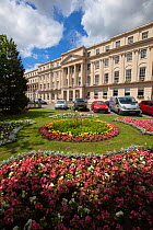 The Promenade building with formal flowerbeds outside the front entrance, Cheltenham, Gloucestershire, UK, July 2011.