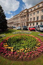 The Promenade building with formal flowerbeds outside the front entrance, Cheltenham, Gloucestershire, UK, July 2011.