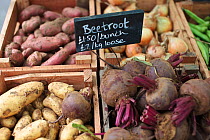Beetroot (Beta vulgaris) and other vegetables for sale at Cirencester Farmers Market, Cirencester, Gloucestershire, UK, July 2011.