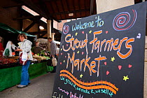 Blackboard welcome information sign within Stroud Farmers Market, Stroud, Gloucestershire, UK, August 2011.