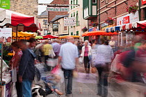 Shoppers moving around stalls, Stroud Farmers Market, Stroud, Gloucestershire, UK, August 2011.
