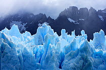 Grey glacier with mountains in the background, Torres del Paine National Park, Patagonia, Chile