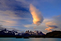 Sunset clouds over Paine mountains, seen from Pehoe Lake, Torres del Paine National Park, Patagonia, Chile