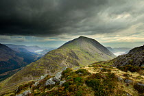 View from the summit of Haystacks towards High Crag, Lake District NP, Cumbria, England, UK, November, with storm sky dark clouds