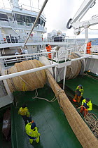 Crew of the pelagic trawler 'Charisma' working the nets, Shetland Islands, Scotland, UK, October 2011 Model Release available