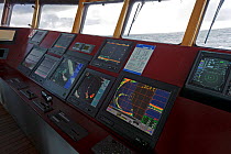 Sonar and navigation instruments on the bridge of the pelagic trawler 'Charisma', Shetland Isles, Scotland, UK, October 2011
