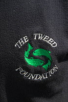 Tweed Foundation badge and logo on a staff t-shirt, Berwickshire, Scotland, UK, August 2011