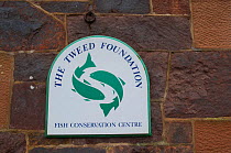 Sign and logo mounted on the outside wall of The Tweed Foundation offices, Roxburghshire, Scotland, UK, October 2011