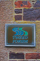 Sign and logo mounted on an outside wall of the offices of The Tweed Forum, Roxburghshire, Scotland, UK, October 2010