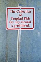 Information sign prohibiting the collection of tropical fish from any coral reef in Florida, USA, February 2011.