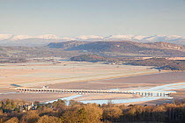View from Arnside Knott towards Arnside viaduct and the Lake District at dawn, Arnside, Cumbria, England, UK, February