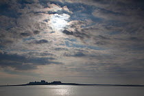 Piel Island silhouetted on the horizon, Morecambe Bay, Cumbria, England, UK, Februay