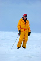 Portrait of tourist guide standing on sea ice, Magdalen Islands, Gulf of St Lawrence, Quebec, Canada, March 2012