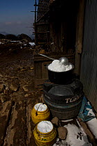 Snow melting pots, part of life on the yak farm of the Tibetan family Buthia, Sandakphu, Kangchenchonga area, West Bengal, India