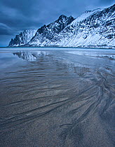 Beach near Okshornan mountains, Senja Island, Troms, Norway, January