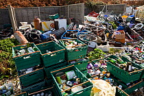 Boxes of recyling stacked at a tip on St. Martin's, Isles of Scilly, UK, October 2011.