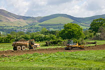 Destruction of countryside in green belt close to market town, for building of houses in flood plain, Vale of Clwyd, Denbighshire, Wales, UK.  This is a highlighted areas in UK at risk of flooding and...