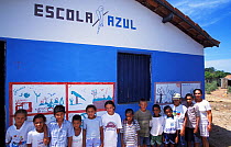Children being taught about the Critically endangered Spix's macaw (Cyanopsitta spixii) at a school near Curaca, Bahia, Brazil, where the last known wild individuals were seen.
