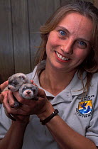 Wildlife biologist Valery Kopsco, with a young Black-footed Ferrets (Mustela nigripes), part of a reintroduction project at Bowdoin National Wildlife Refuge, Montana, March 2002.