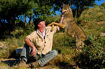 Daniel Weigend, owner of the Lobo Park, with Iberian Wolf (Canis lupus signatus). Antequera, Spain, January 2007.