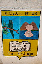 Sign and logo of the Yellow-shouldered Amazon conservation project. Isla Margarita, Nueva Esparta, Venezuela, 2007.