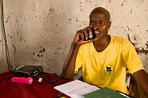 Ranger of the Ishaqbini Reserve Northern Rangelands Trust at the headquarters, speaking on the radio. Kenya.