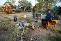 Park rangers relaxing at their camp. Ishaqbini Reserve, Kenya, 2009.
