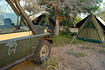 Vehicles and tents of park-rangers' camp. Northern Rangelands Trust, Ishaqbini Reserve, Kenya, 2009.