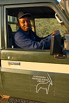 Park ranger in his vehicle. Northern Rangelands, Ishaqbini Reserve, Kenya, 2009.