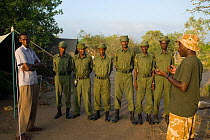 Park wardens having a meeting at their camp. Ishaqbini Reserve, Northern Rangelands Trust, Kenya, 2009.