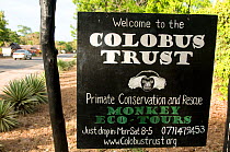 Sign advertising eco-tours with the Colobus Trust, Primate Conservation Research and Rescue. Ukunda, Kenya, Africa.