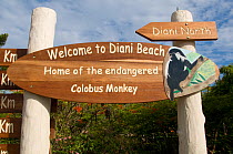 Welcome sign at Diani Beach, illustrated with painting of a Colobus Monkey. Ukunda, Kenya.