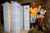 Ana Maria Velasquez, conservation worker with artificial nesting boxes for parrots to raise chicks in. Orejiamarillo Nature Park, Jardin, Antioquia, Colombia.