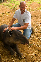 Juan Jose Rojas, zoo director at La Marina Wildlife Rescue Centre, with a Baird's Tapir (Tapirus bairdii). La Marina Wildlife Rescue Center, Costa Rica. 2008